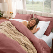 Woman sleeping in a bed with percale bedding