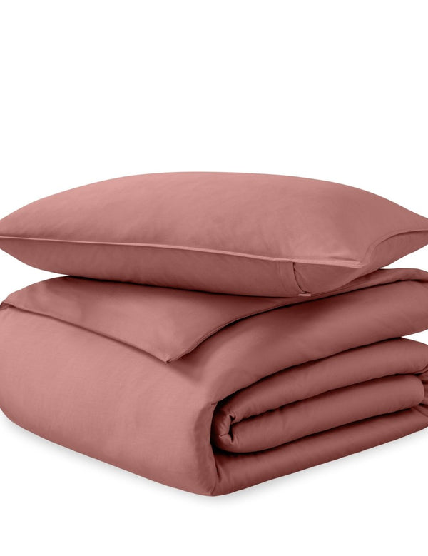 A sateen duvet set arranged in a stack