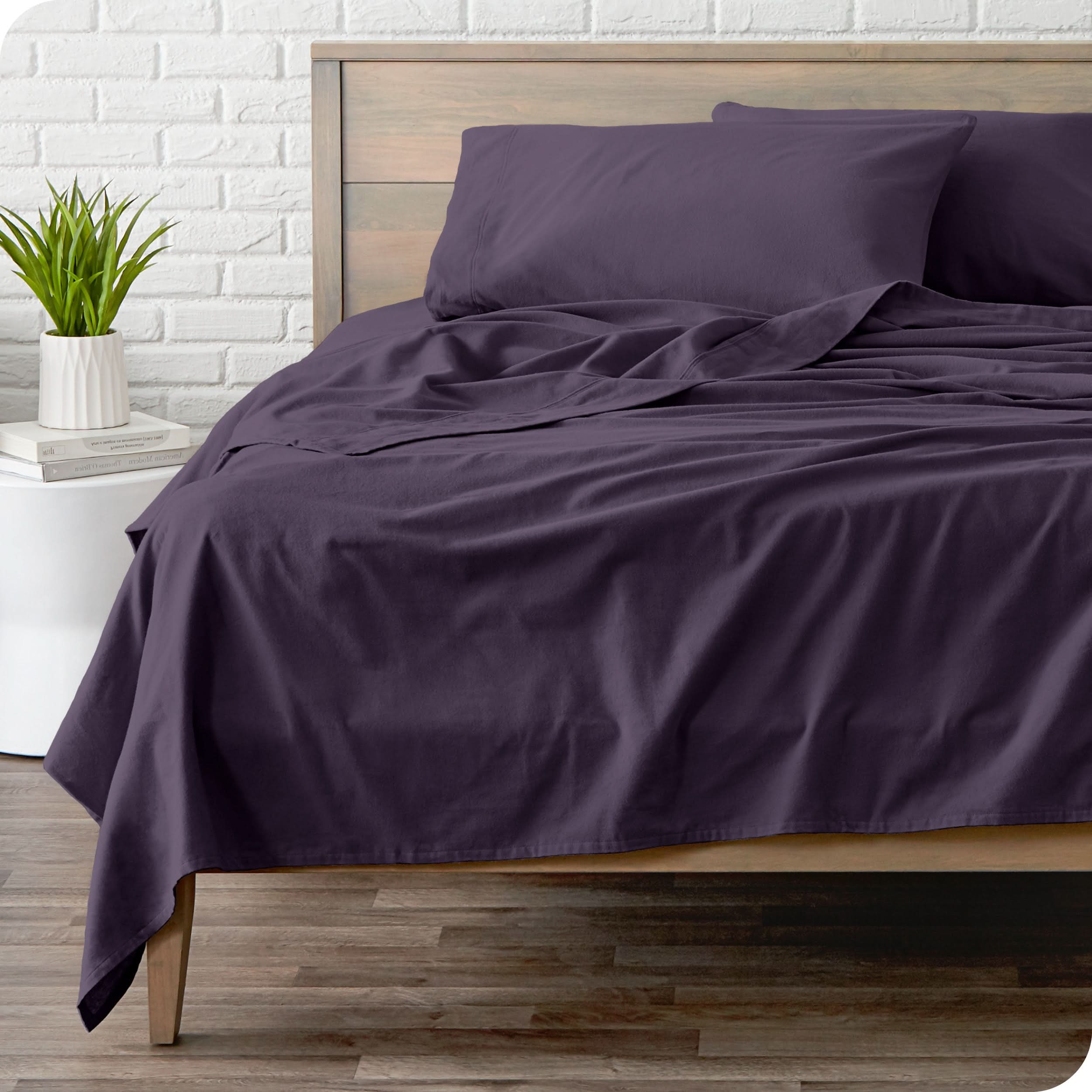 A modern bed with a flannel sheet set on