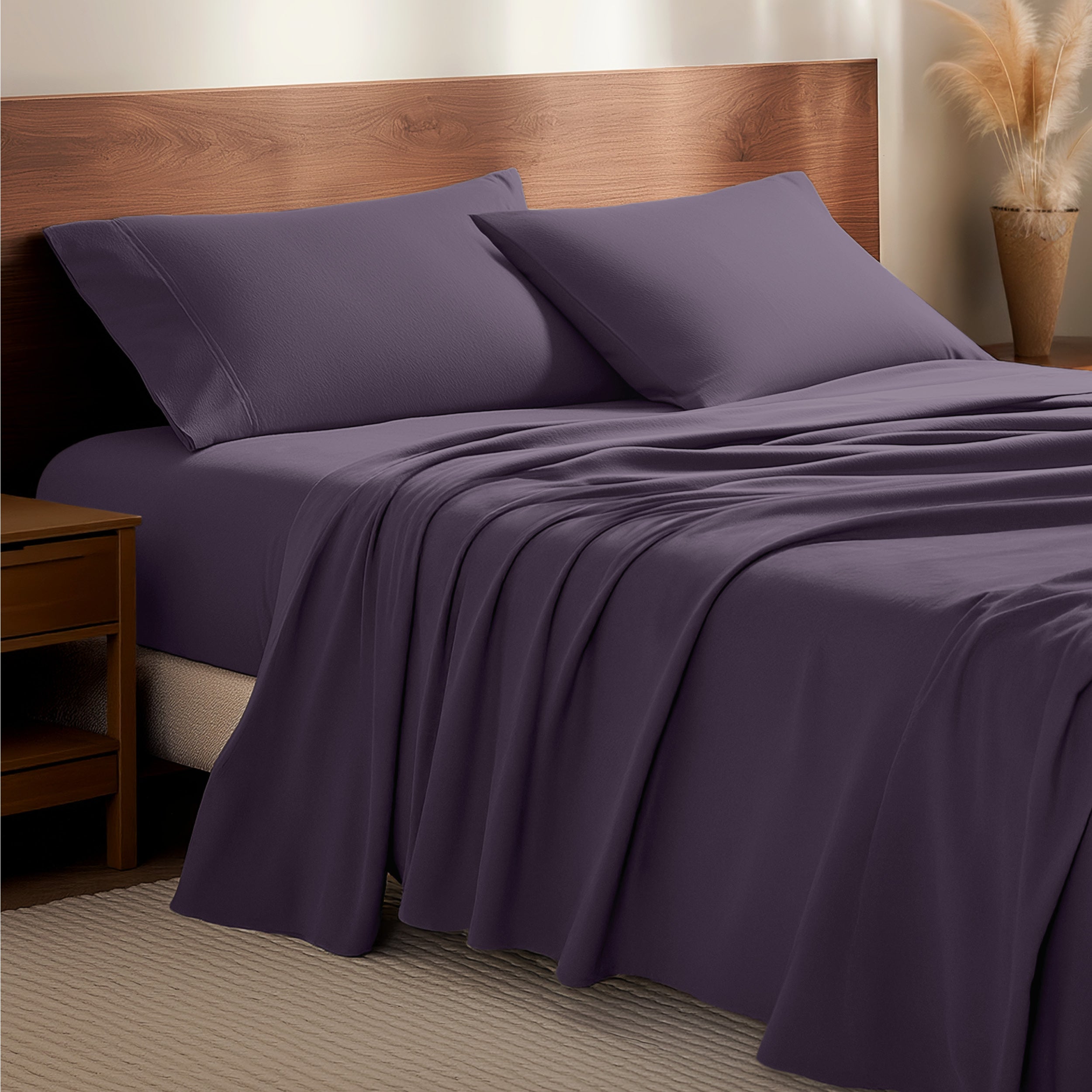 Flannel bedding set on a bed with a wooden headboard and side table