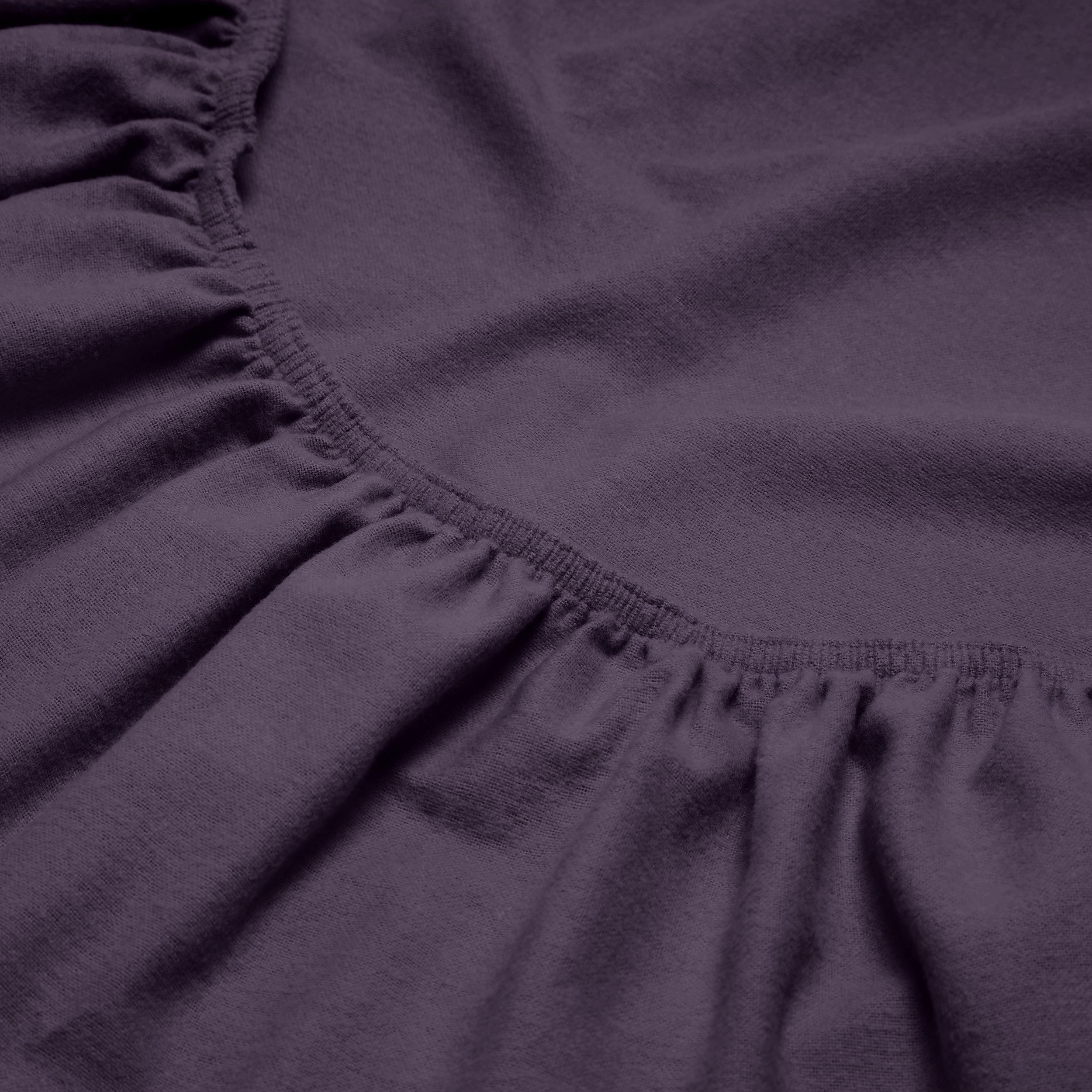 Close-up of a flannel fitted sheet with gathered elastic