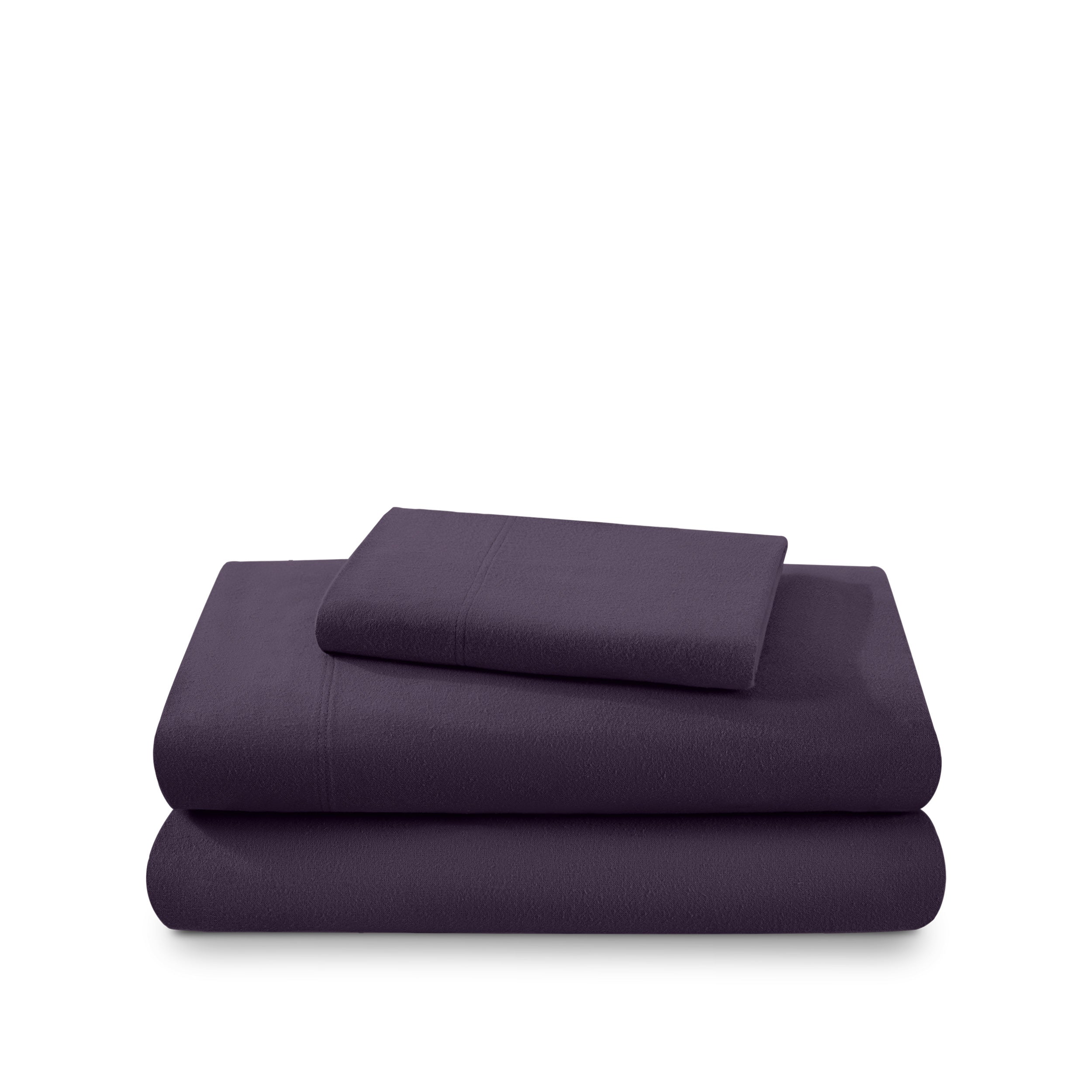 Cotton flannel sheet set folded and stacked on a white background