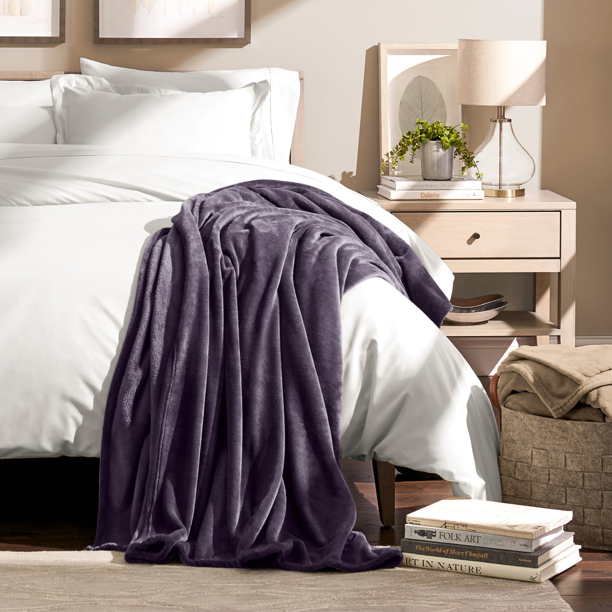 Microplush blanket draped over the corner of a bed
