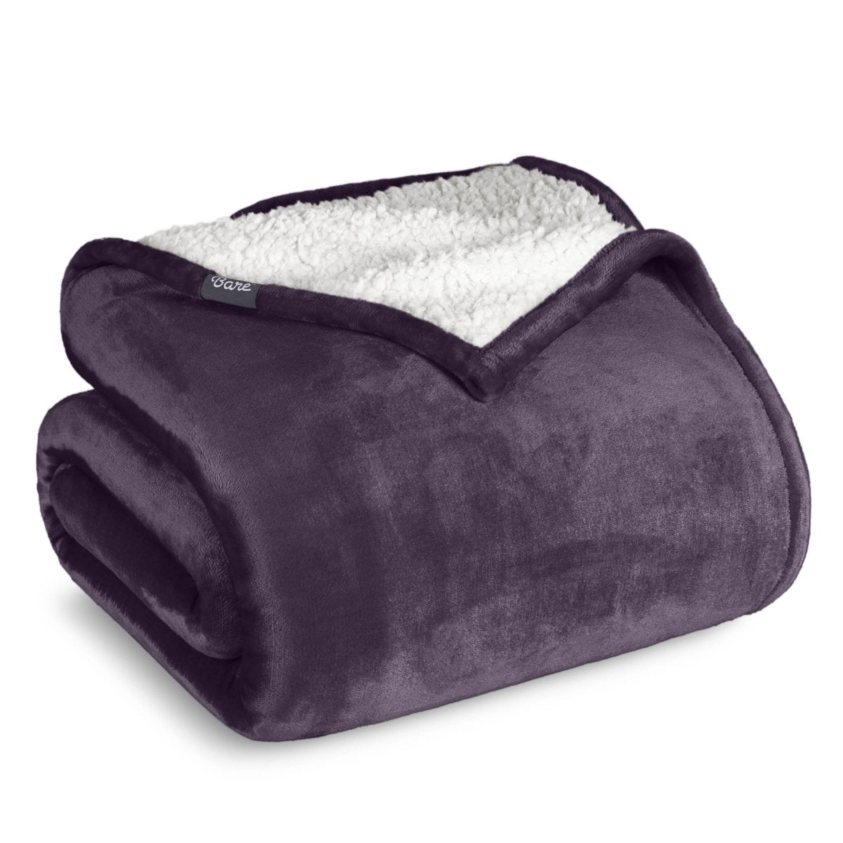 A sherpa blanket folded neatly while showing both sides
