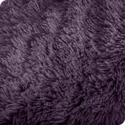 Close up of the soft texture of a shaggy faux fur sherpa blanket