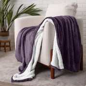 Blanket draped over a chair in a cozy living room setting.