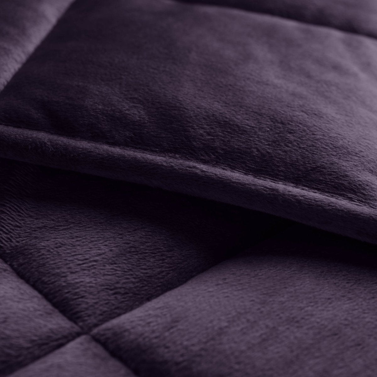 Close-up of a weighted blanket showing the stitching and texture