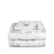 Stack of flannel sheets and pillowcases on a white background
