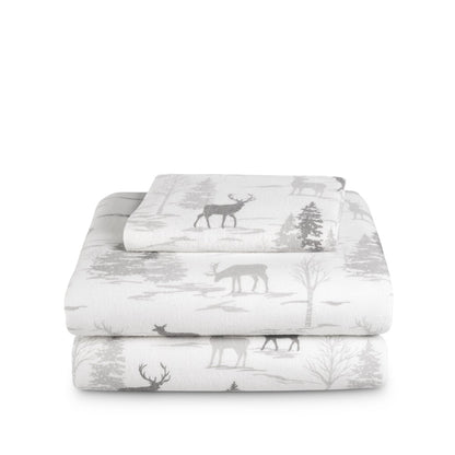 Stack of flannel sheets and pillowcases on a white background