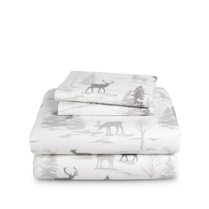 Stack of flannel sheets and pillowcases on a white background