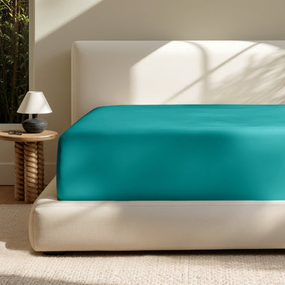 A deep pocket mattress with a fitted sheet on it