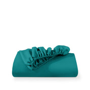 A fitted sheet folded neatly with the all around elastic showing