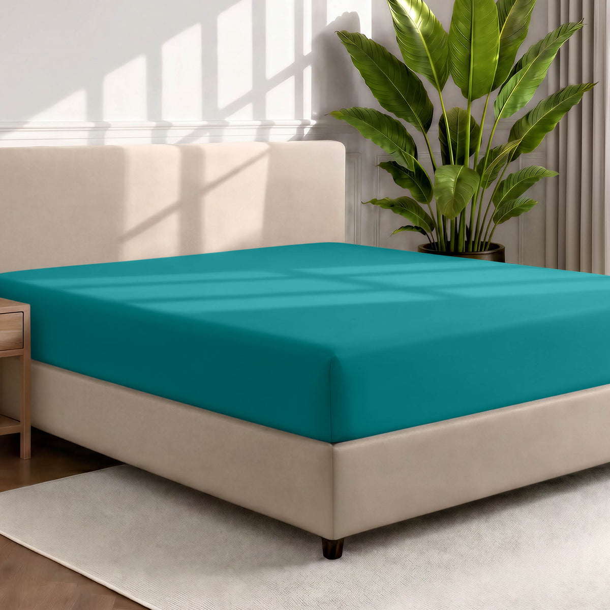 Ultra soft fitted sheet on a mattress with the sun shining into the bedroom