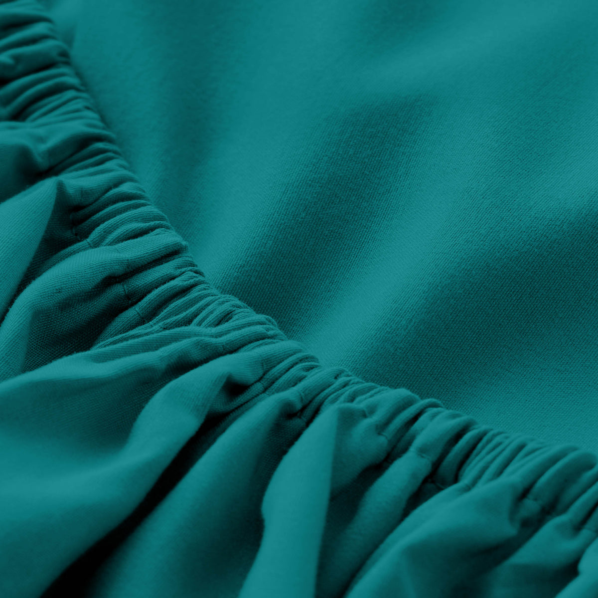 Close-up of fitted sheet with all around elastic