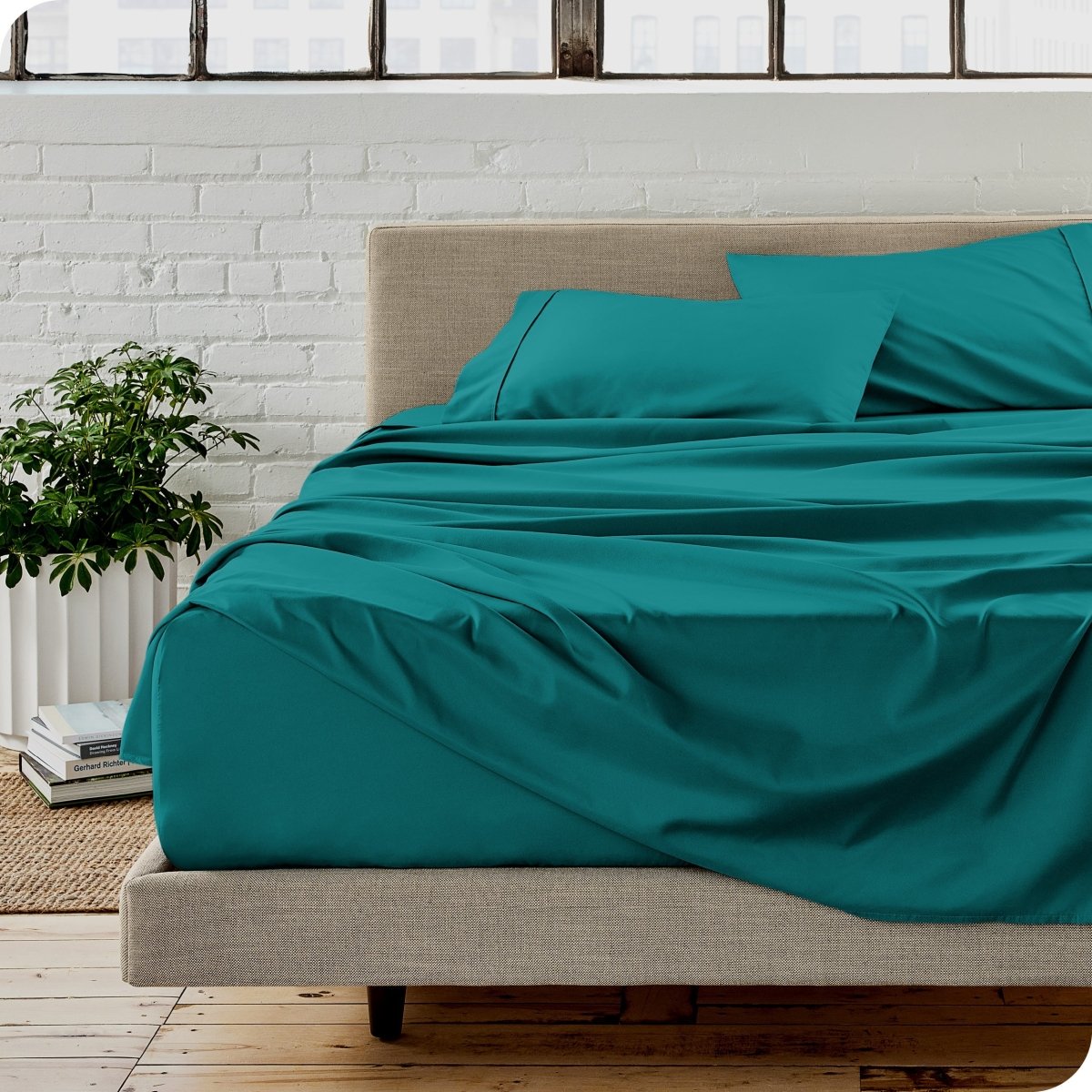 A modern bedroom with microfiber sheets on the mattress