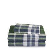 Stack of flannel sheets and pillowcases on a white background