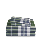Stack of flannel sheets and pillowcases on a white background