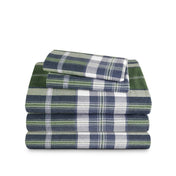 Stack of flannel sheets and pillowcases on a white background