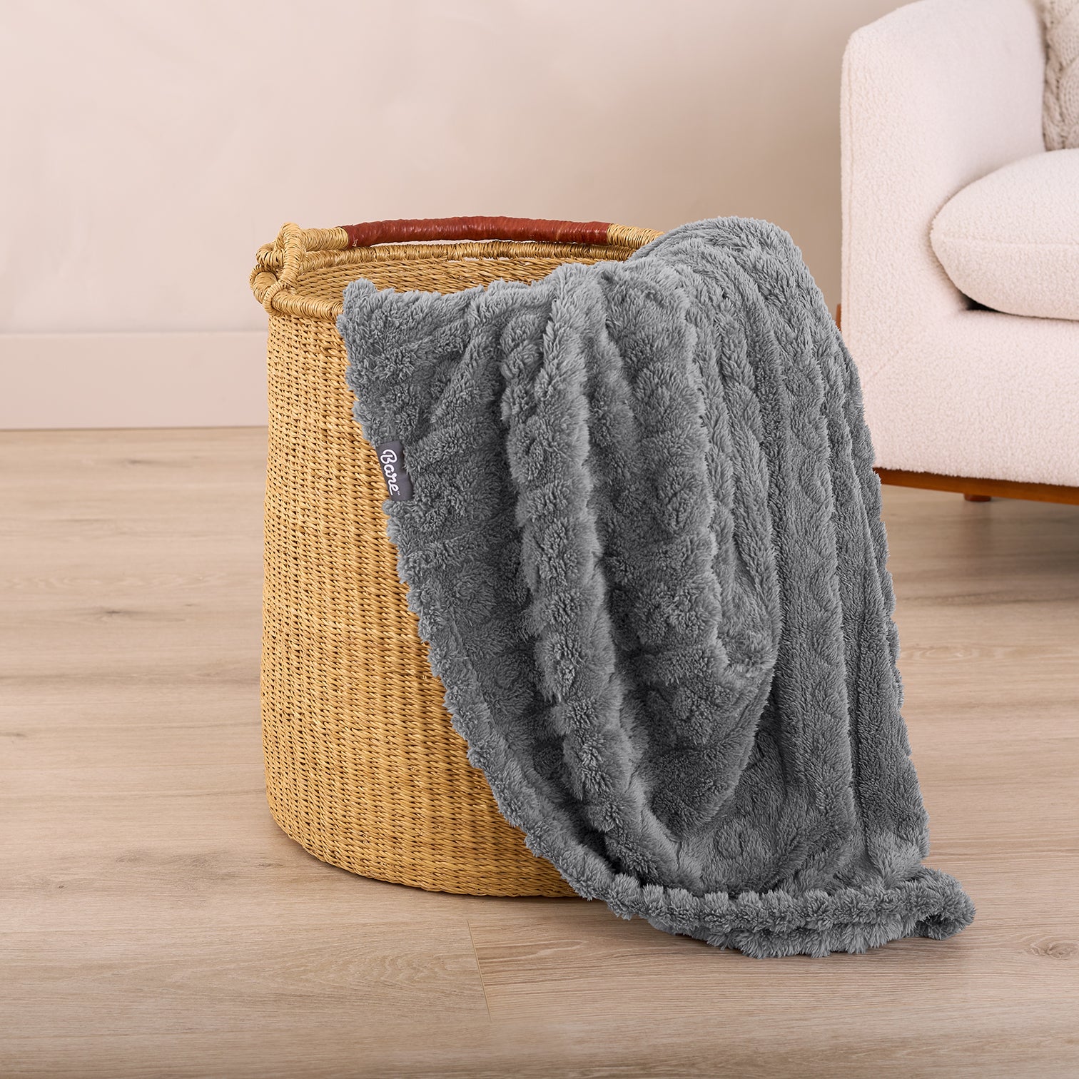 Grey Cable Knit Blanket In Clothes Basket