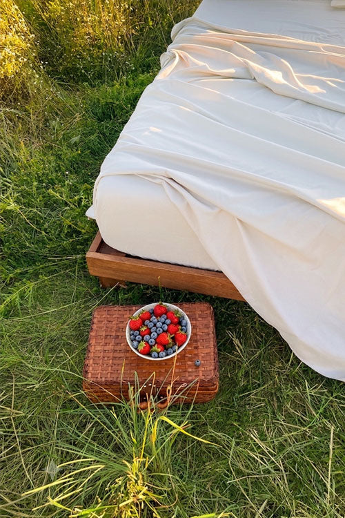 Bed in a field in summer