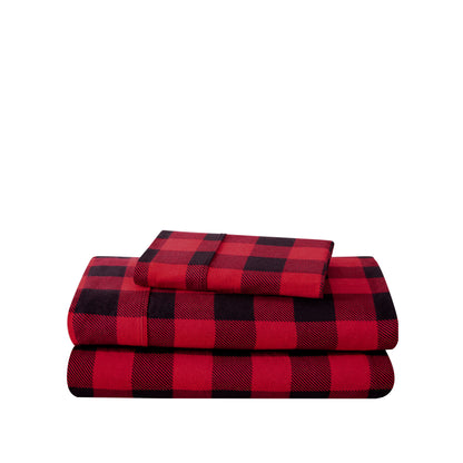 Stack of flannel sheets and pillowcases on a white background