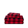 Stack of flannel sheets and pillowcases on a white background