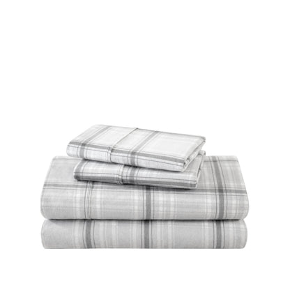 Stack of flannel sheets and pillowcases on a white background