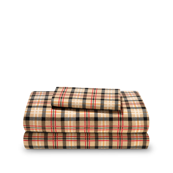 Stack of flannel sheets and pillowcases on a white background