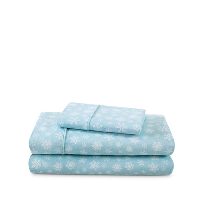 Stack of flannel sheets and pillowcases on a white background