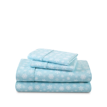 Stack of flannel sheets and pillowcases on a white background