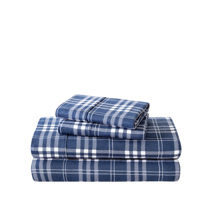 Stack of flannel sheets and pillowcases on a white background