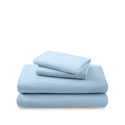 Cotton flannel sheet set folded and stacked on a white background