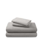 Cotton flannel sheet set folded and stacked on a white background