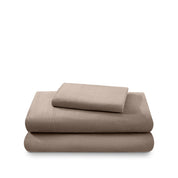 Cotton flannel sheet set folded and stacked on a white background