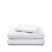 Cotton flannel sheet set folded and stacked on a white background
