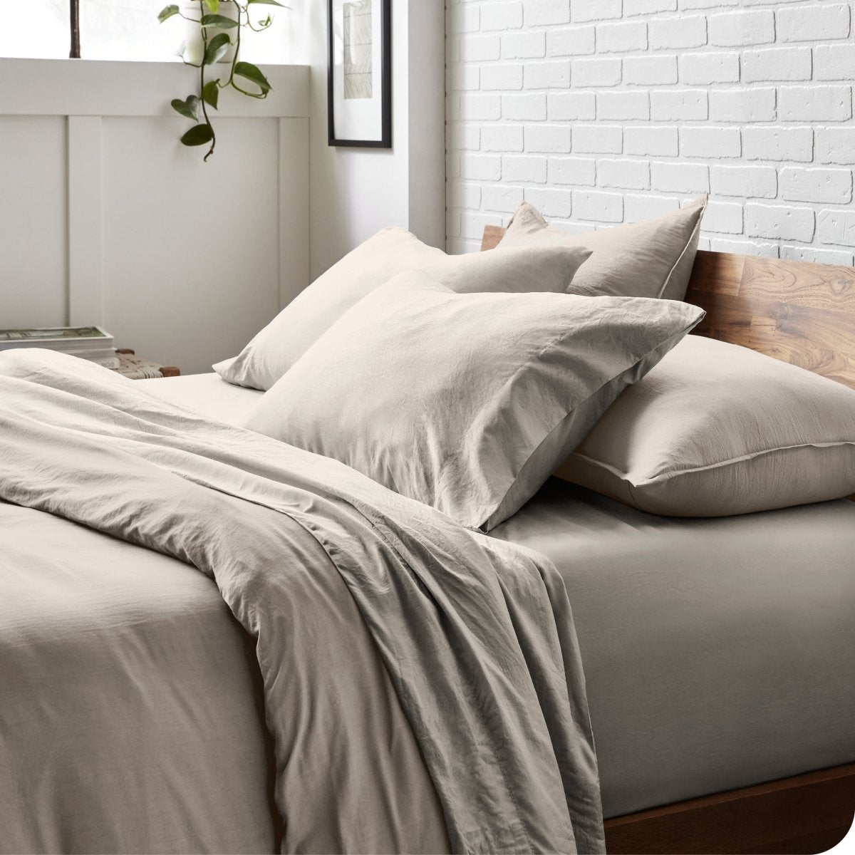 Modern bedroom with washed sheets and duvet cover on a bed