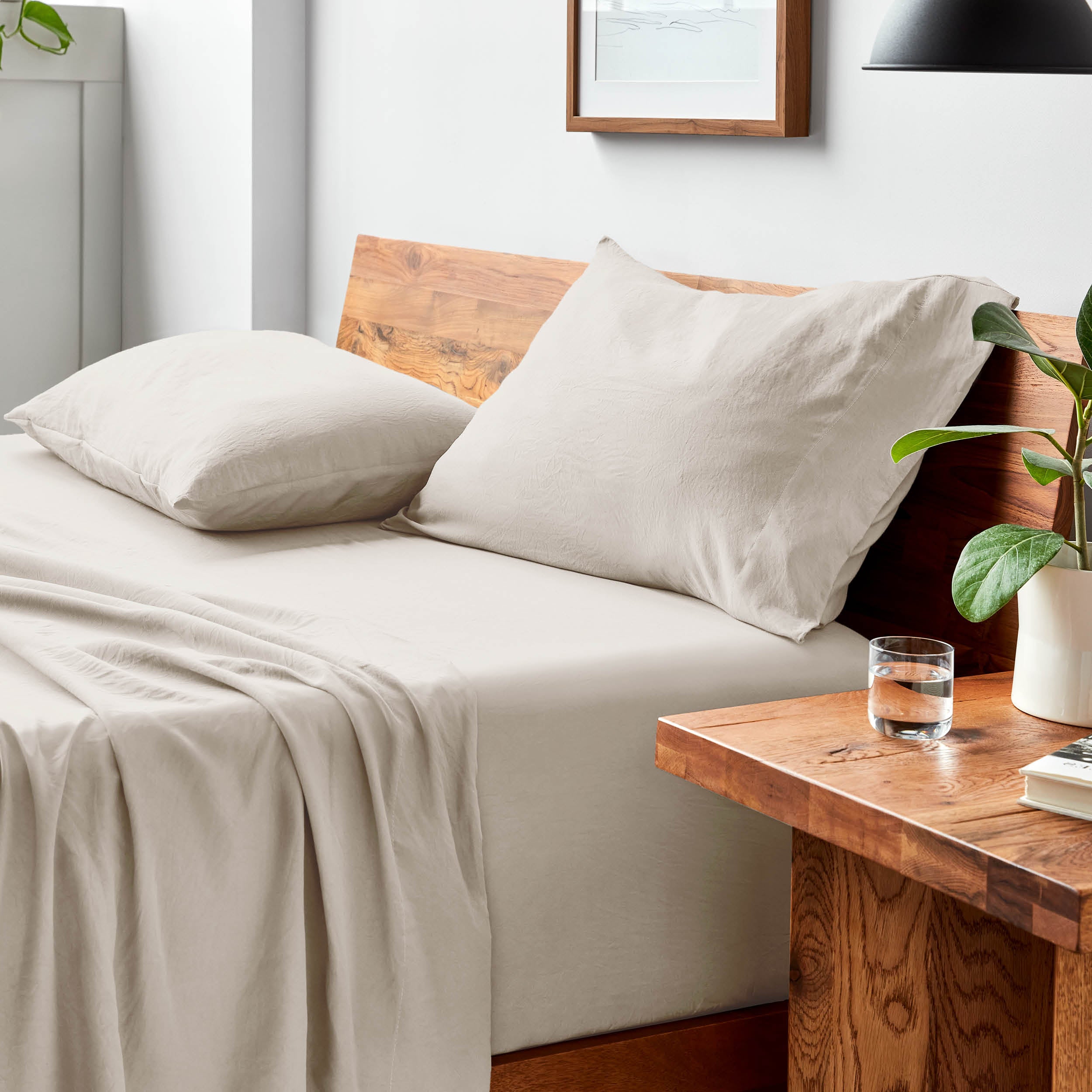 Bed with microfiber bedding and pillows in a bedroom setting
