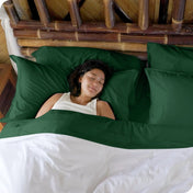 A woman sleeping in a bed made with bamboo sheets