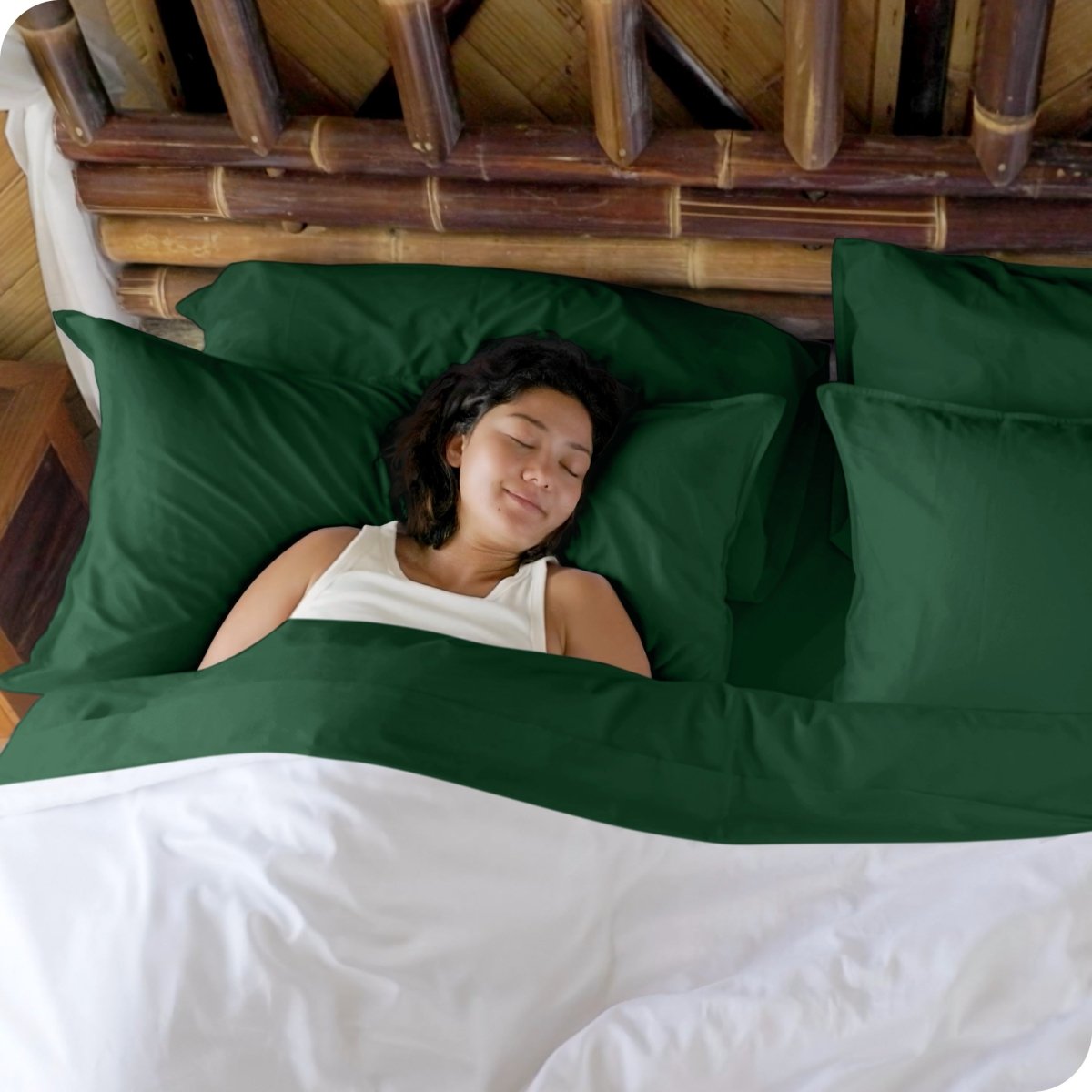 A woman sleeping in a bed made with bamboo sheets
