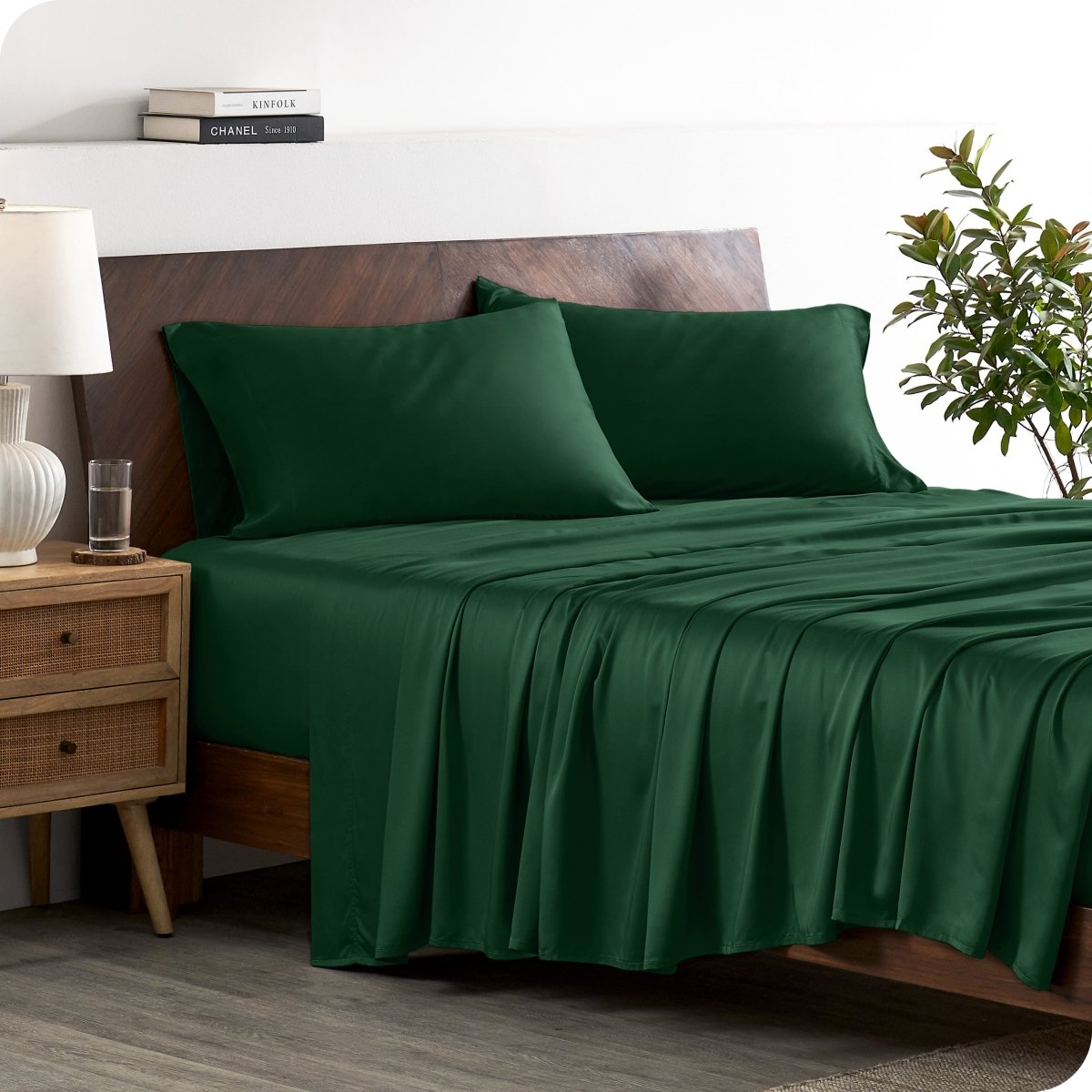 A stylish bed with bamboo sheets and pillowcases, showcasing a sophisticated and elegant bedroom setting.