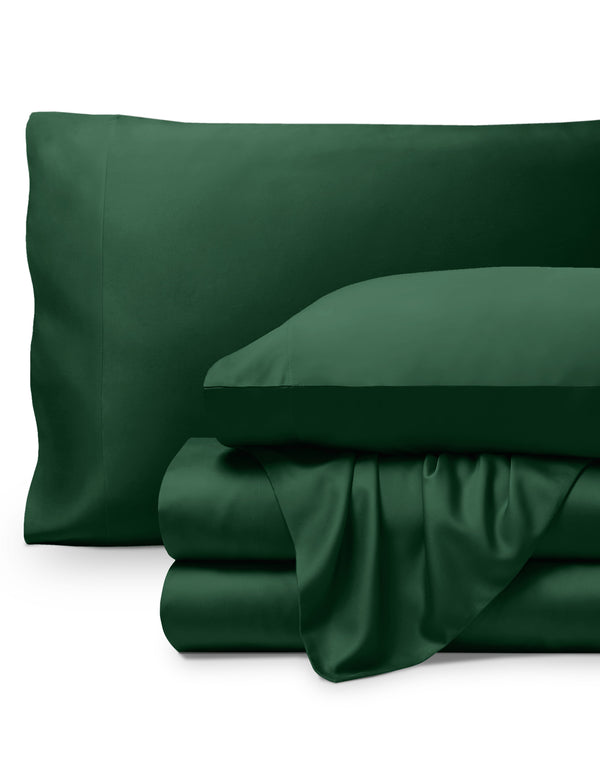 Bamboo pillowcases and sheets set on a white background