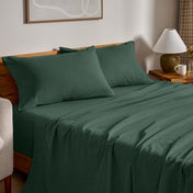 Flannel bed sheets and pillowcases on a bed in a bedroom setting.