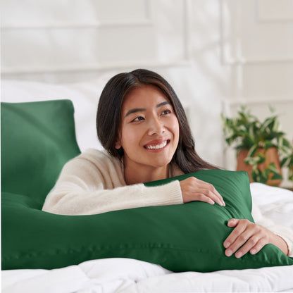 Woman lying on abed with a silk pillowcase