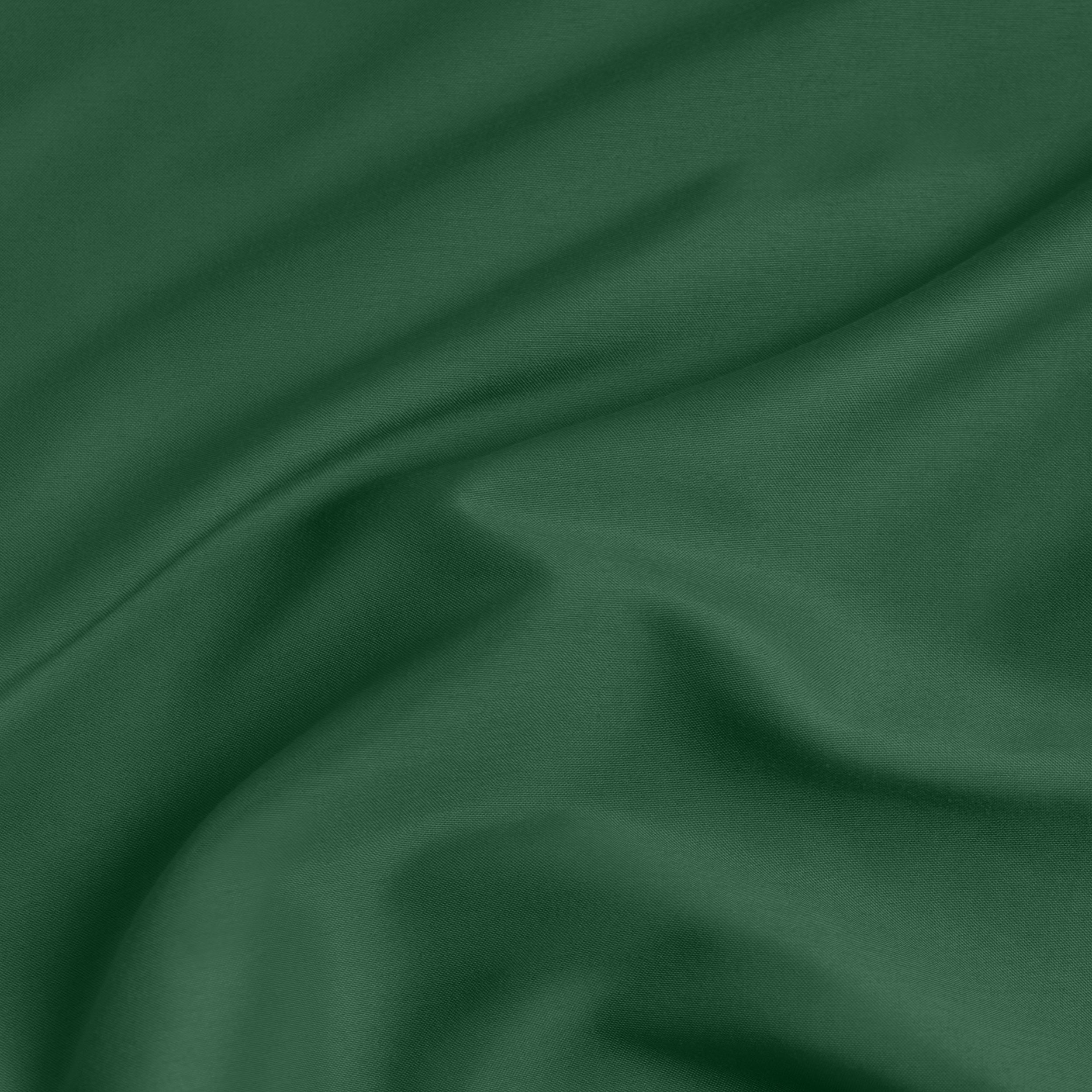A close-up of a fitted sheet with a label printed with the word 'BOTTOM' in white.