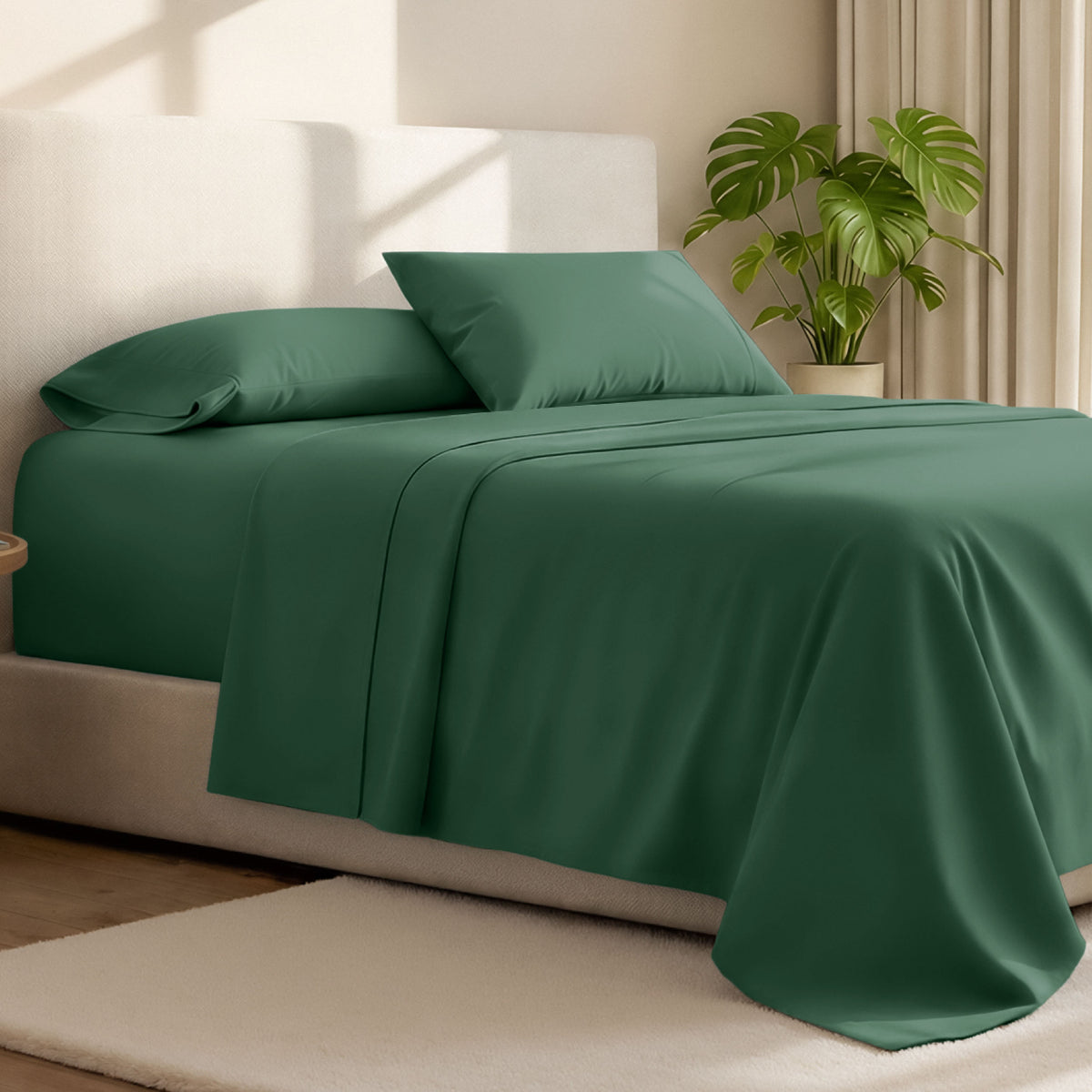 Microfiber bed sheets on a neatly made bed with a wooden headboard and nightstand.