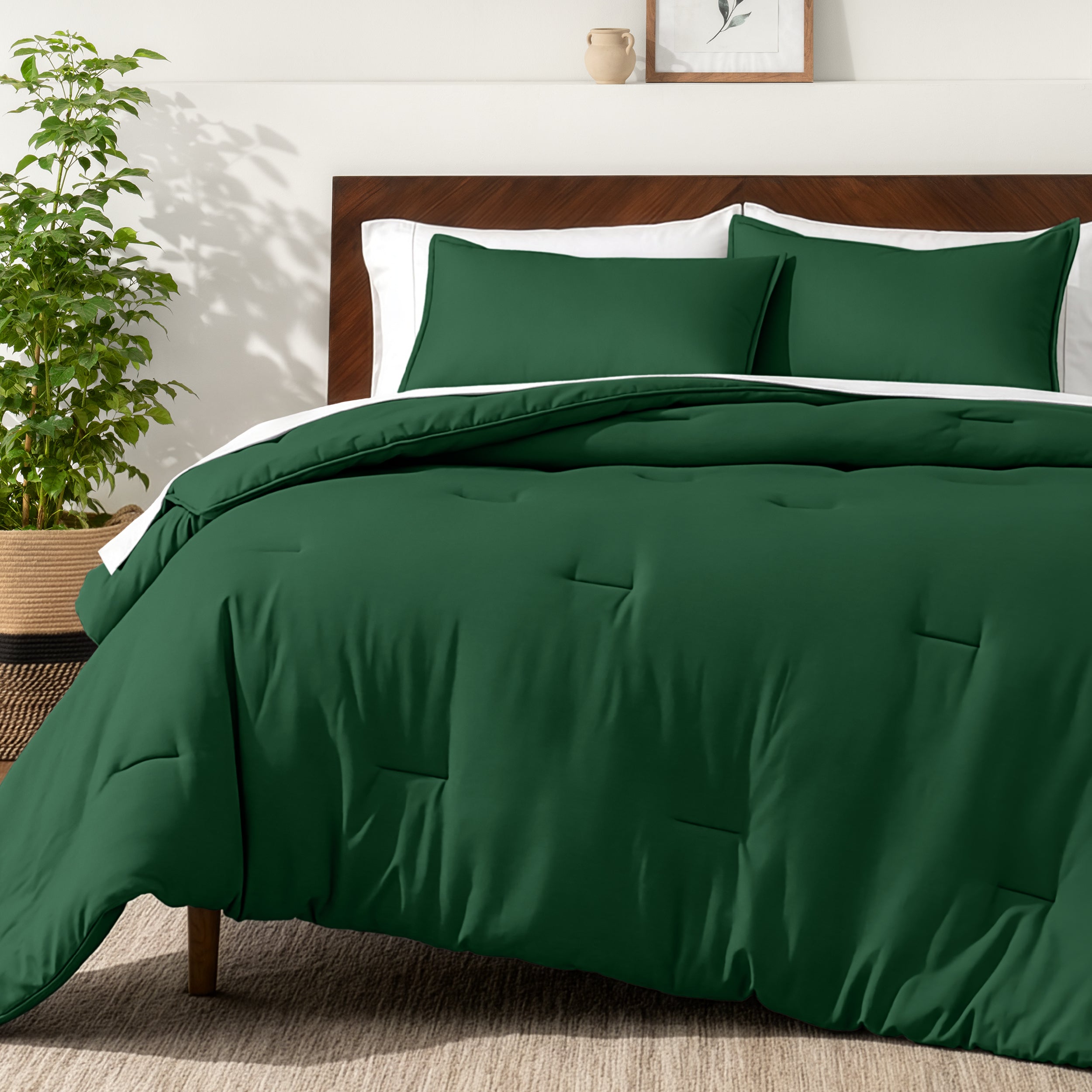 Bedding set on a bed in a bedroom with a side table and lamp.