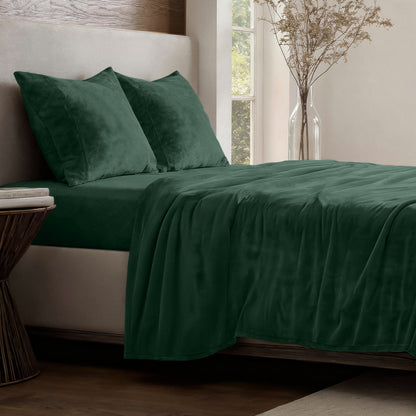 Neatly made bed in a well-lit bedroom.