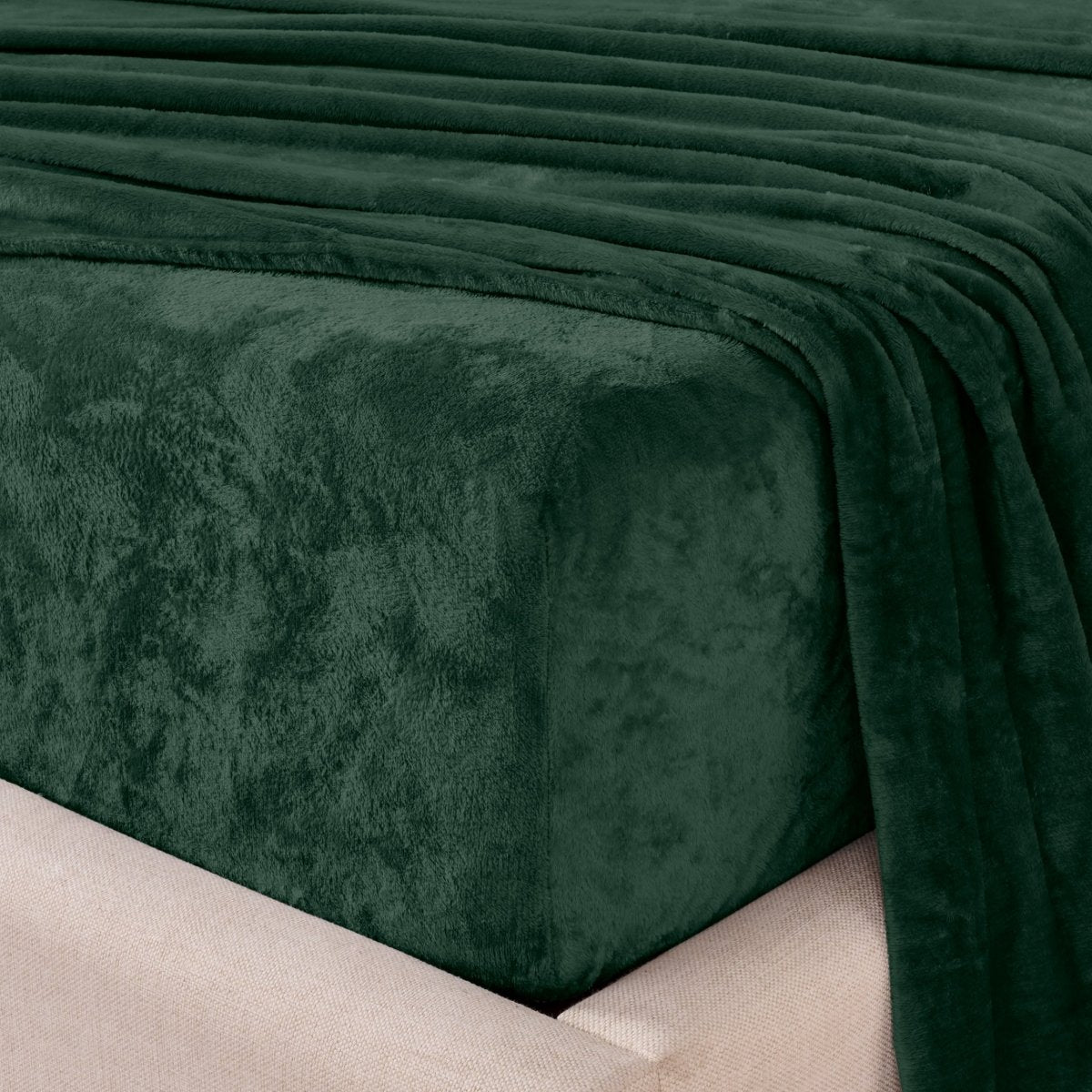 Close-up of the corner of a bed made with microplush sheets