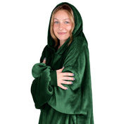 A woman is snuggled up in microplush wearable blanket