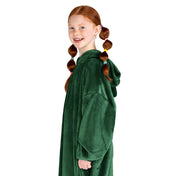 A girl has a microplush wearable blanket on